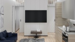 Ett kök och en tv i ett vardagsrum