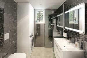 lyxigt badrum i attefallshus med svart marmor, förvaring och tvättmskin